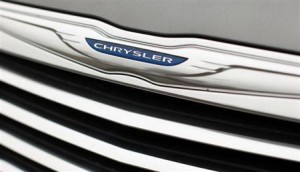 A Chrysler badge is pictured on a new car at a dealership in Vienna, Virginia