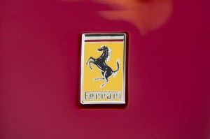 A Ferrari logo is seen on a Ferrari outside NYSE