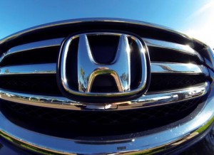 The front grill of a Honda truck is shown on car lot in Carlsbad, California