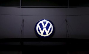 A logo of Volkswagen is illuminated at a dealership in Seoul